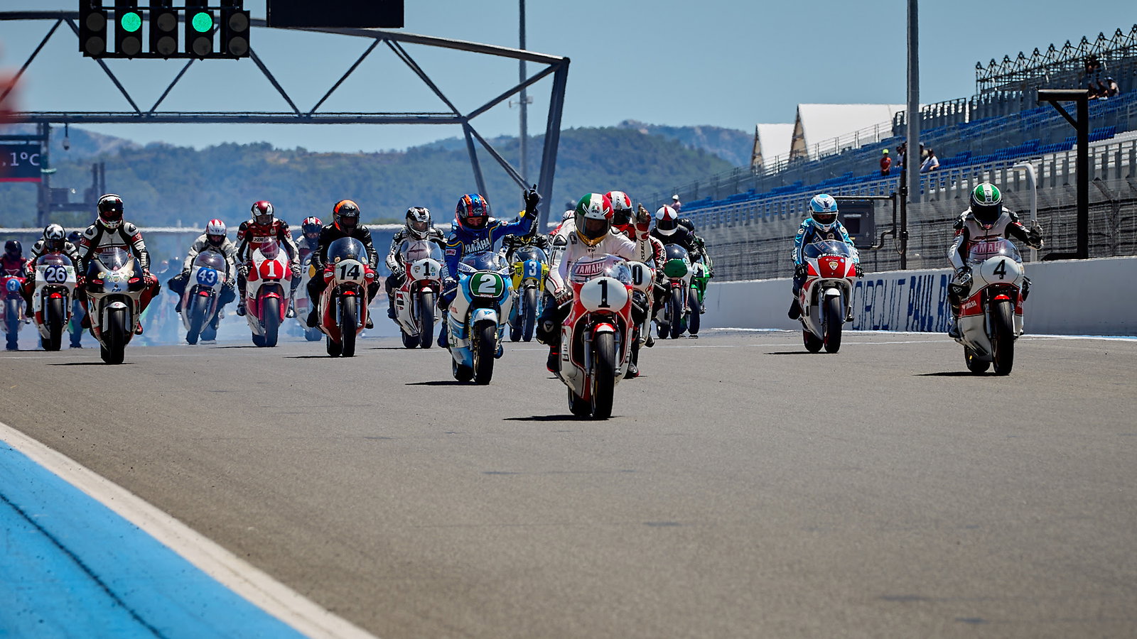 Giacomo Agostini leads Yamaha Heritage Club bikes at Le Castellet. - Yamaha Racing
